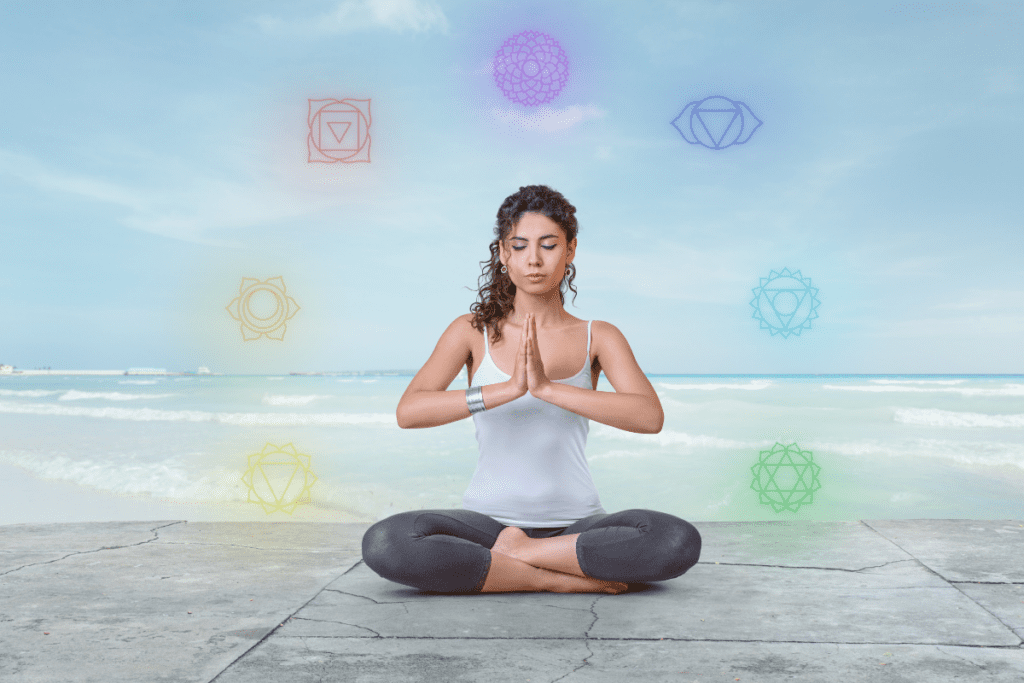chakra balancing - woman meditation sitting on the floor