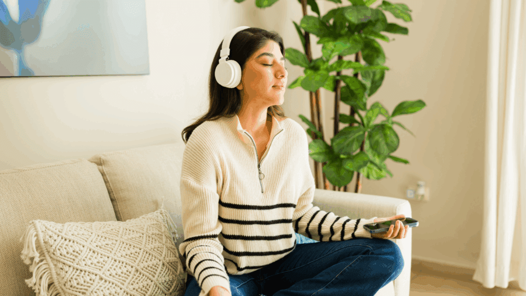 young woman listening to subliminals 