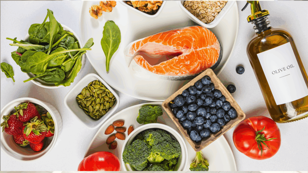 anti inflammatory foods - blueberries, fresh spinach, olive oil, walnuts, tomatoes, strawberries, broccoli, almonds, and pumpkin seeds
