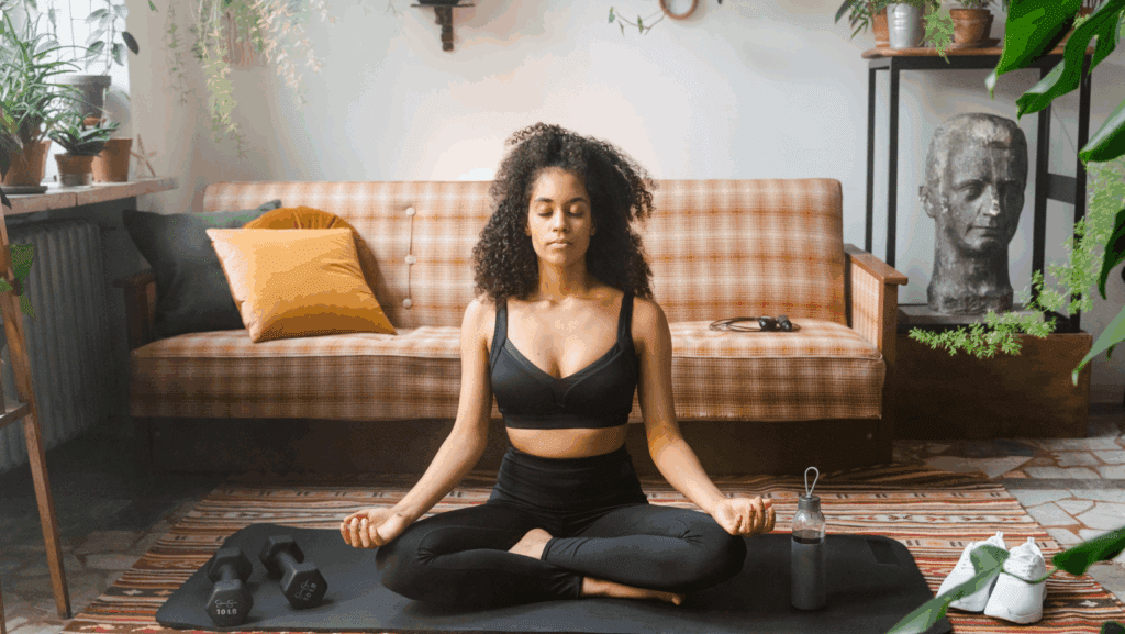 how to recover from burnout - young women meditating on the floor